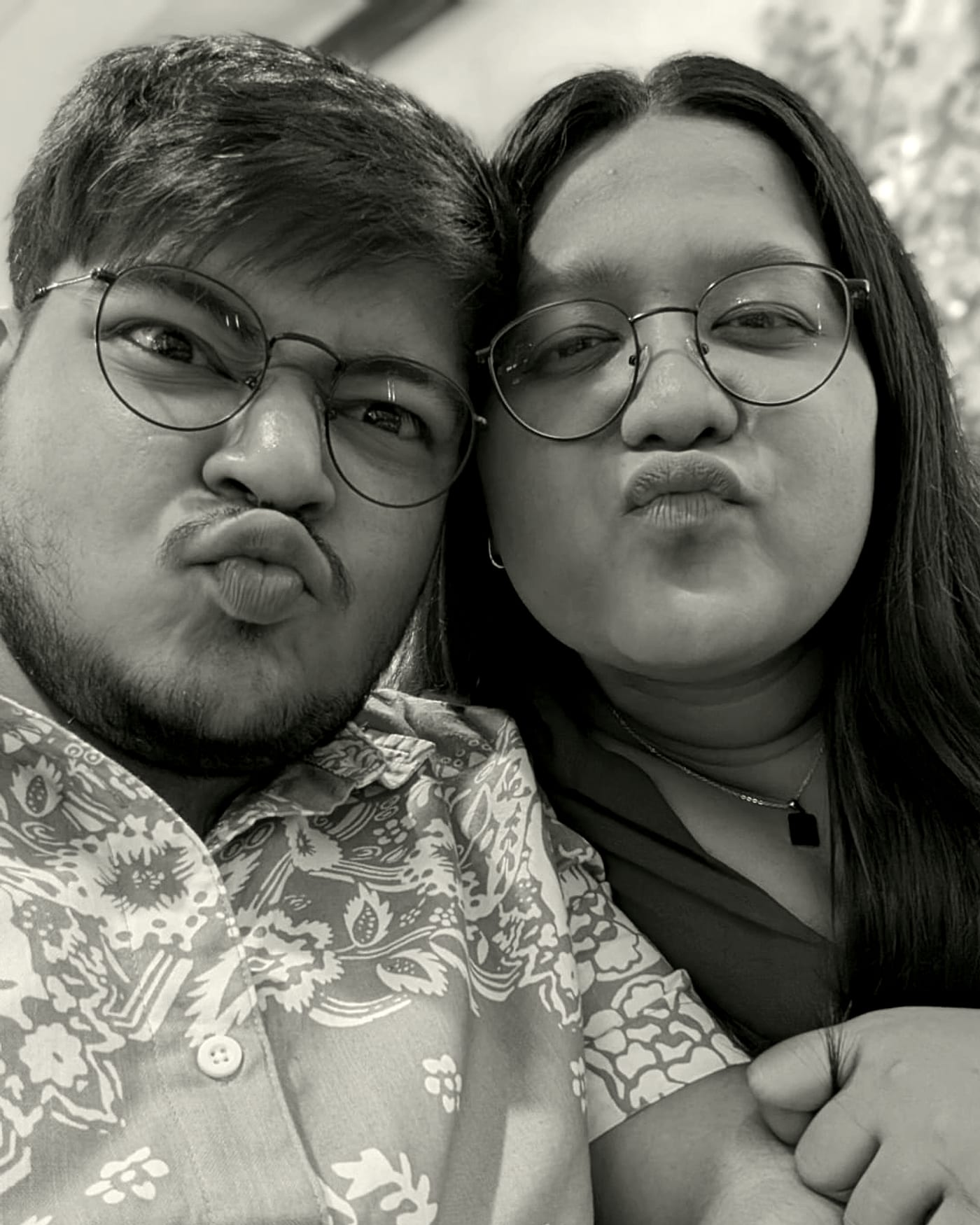 Rachel and Praduan pulling faces at the camera
